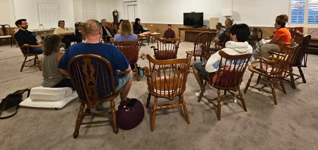 A group of people practicing meditation in Lake Worth, Florida.